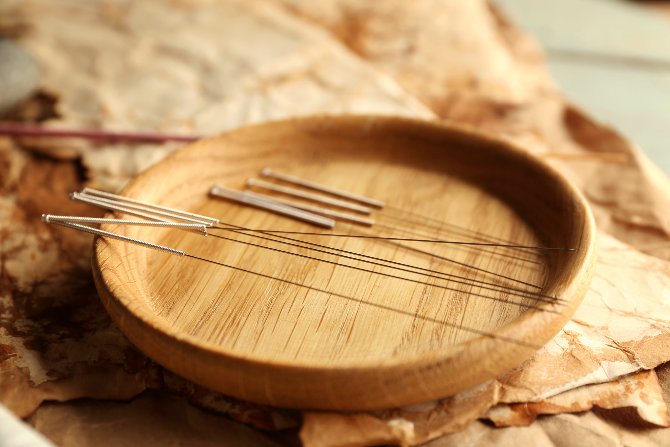 Acupuncture Needles on Wooden Table